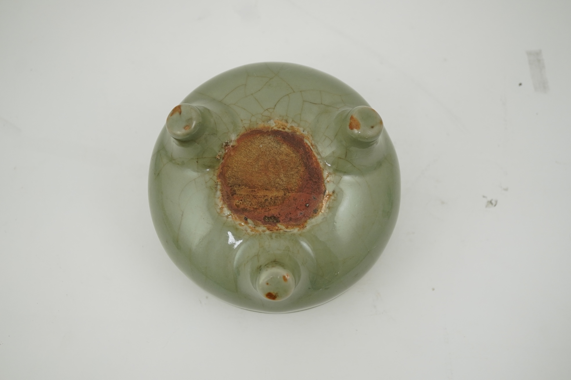 A Chinese Longquan celadon crackle glazed tripod censer, Ming dynasty or later